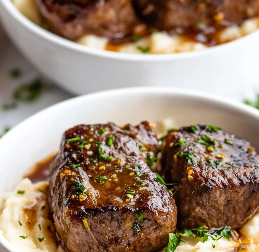 Garlic Butter Steak Bites served with creamy mashed potatoes