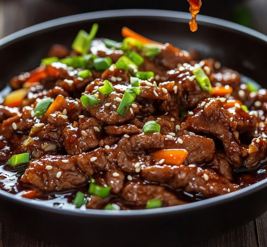 Delicious Mongolian Beef stir-fry cooked in a traditional wok.